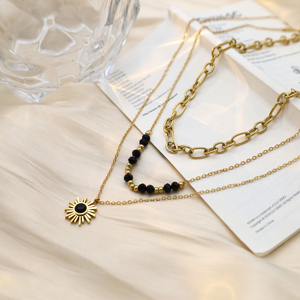 Stainless steel gold-plated three-layer black rice bead sun necklace MYA-XuanJ035