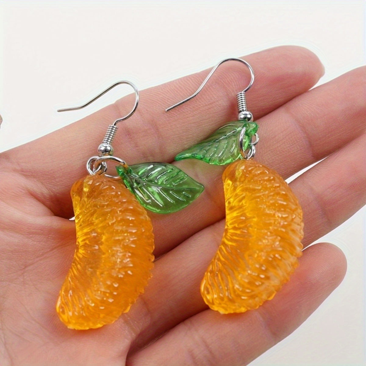 Alloy resin green leaf big yellow pomelo earrings (Minimo de compra 2） MYA-GenL003