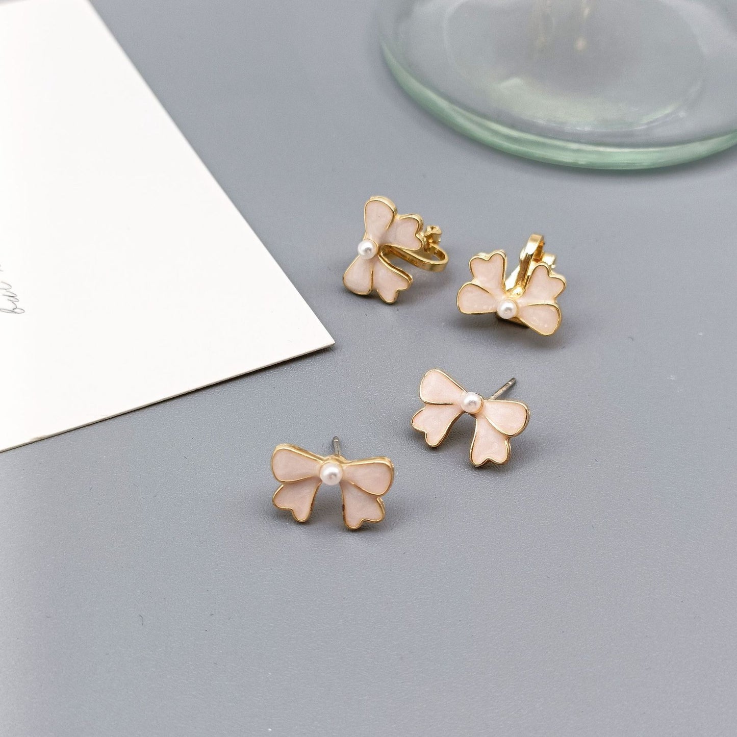 Alloy drip pearl bow ear clip (Minimo de Compra 2) MIC-KaiT014