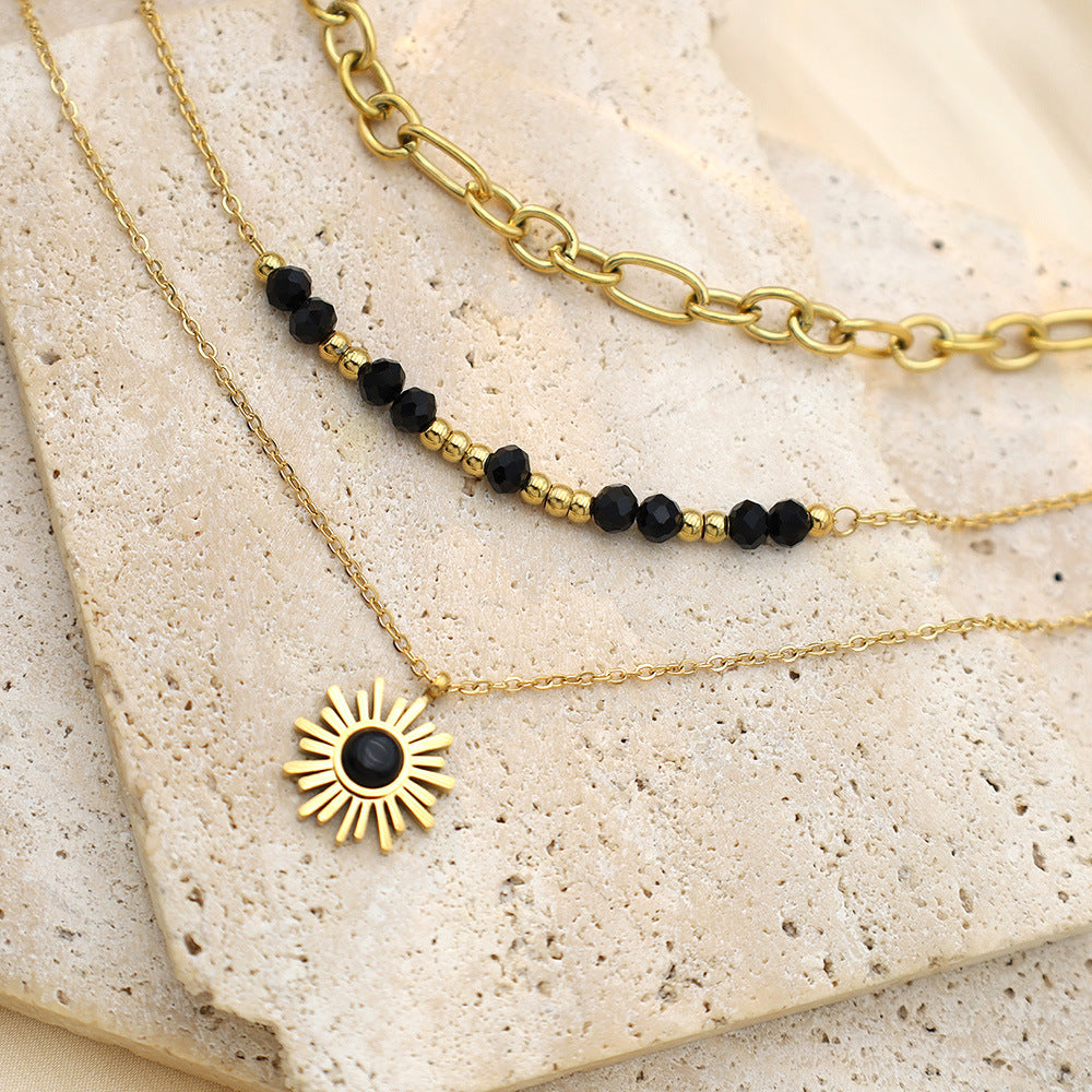 Stainless steel gold-plated three-layer black rice bead sun necklace MYA-XuanJ035