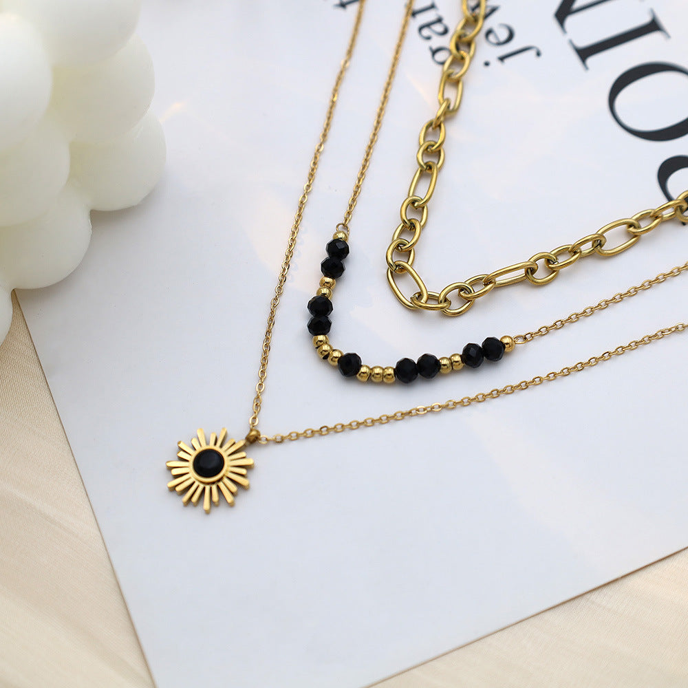 Stainless steel gold-plated three-layer black rice bead sun necklace MYA-XuanJ035