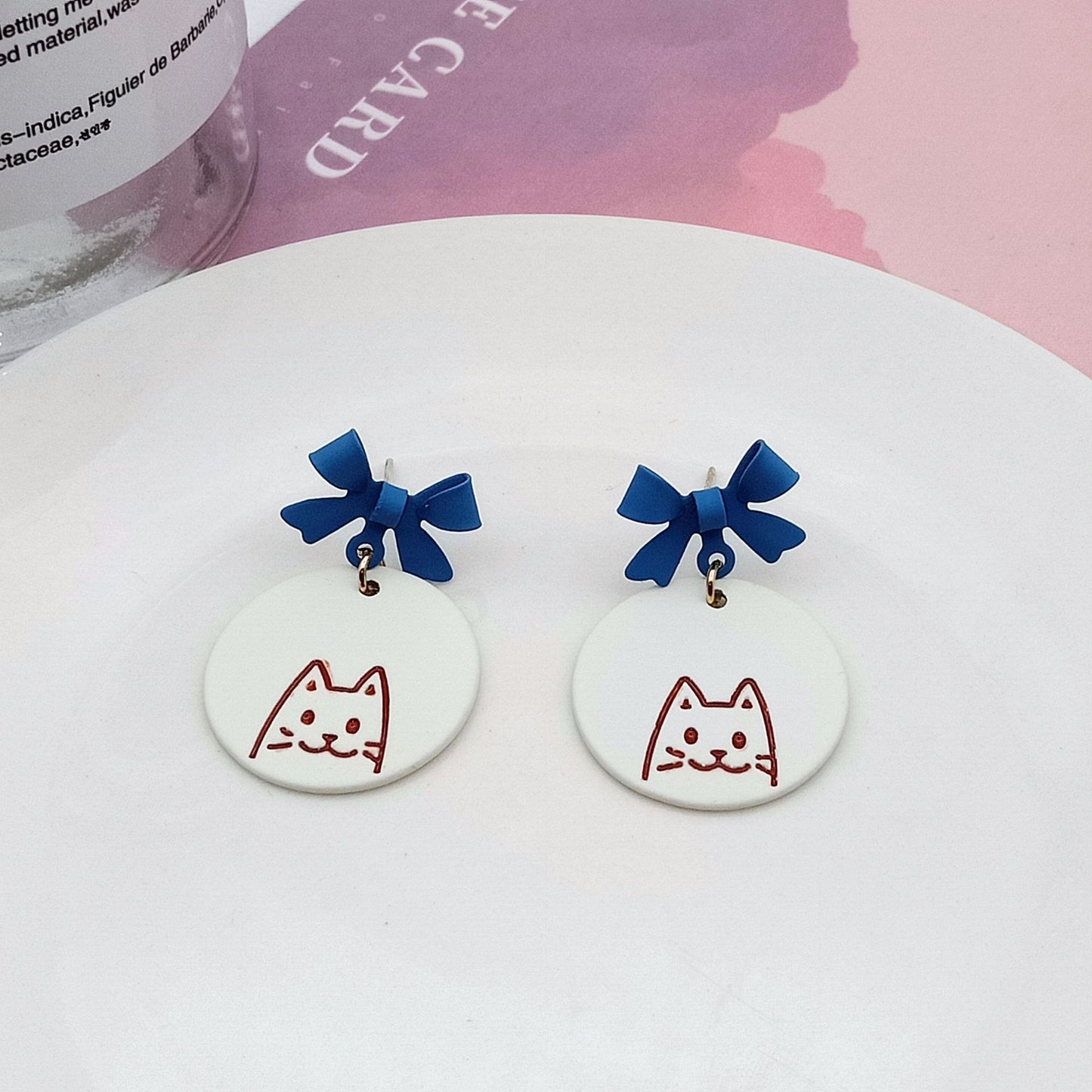 Alloy blue bow ear clip (Minimo de Compra 2) MYA-KaiT008