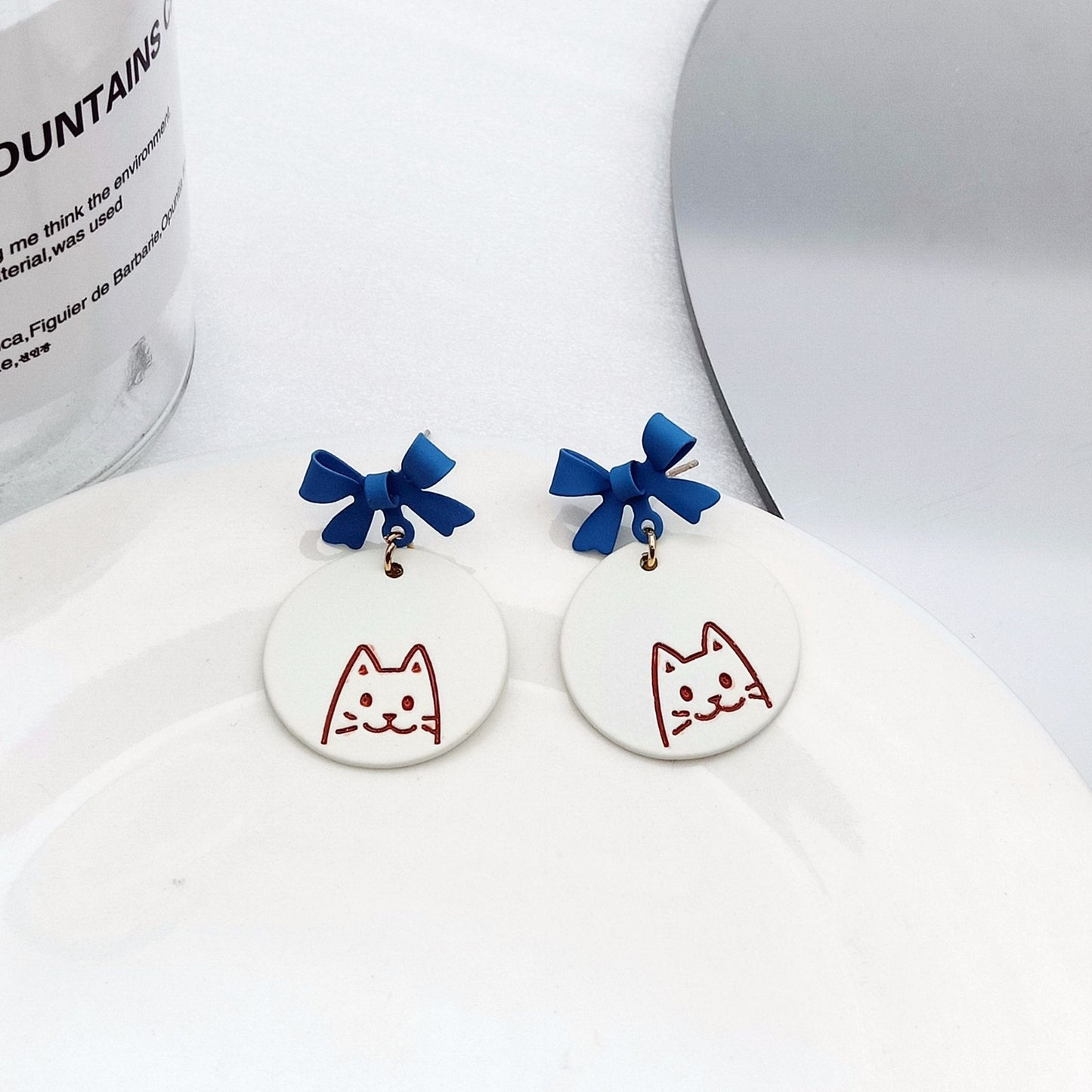 Alloy blue bow ear clip (Minimo de Compra 2) MYA-KaiT008