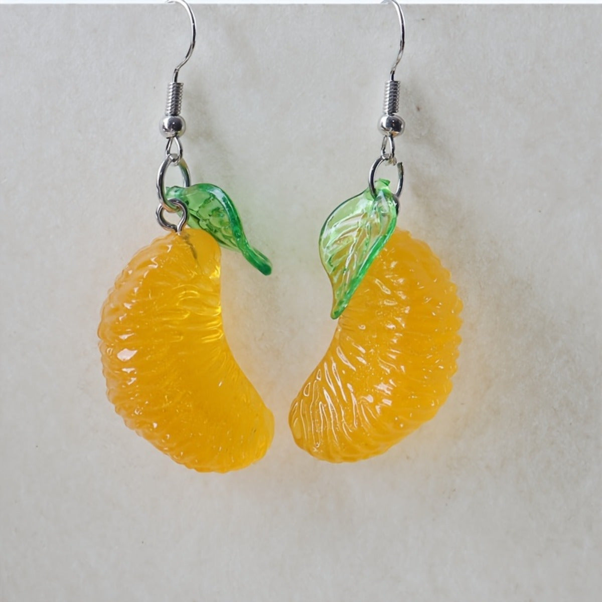 Alloy resin green leaf big yellow pomelo earrings (Minimo de compra 2） MYA-GenL003