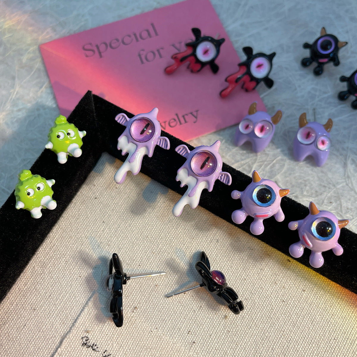 Alloy heterochromatic cute little monster earrings MYA-ShuangX050