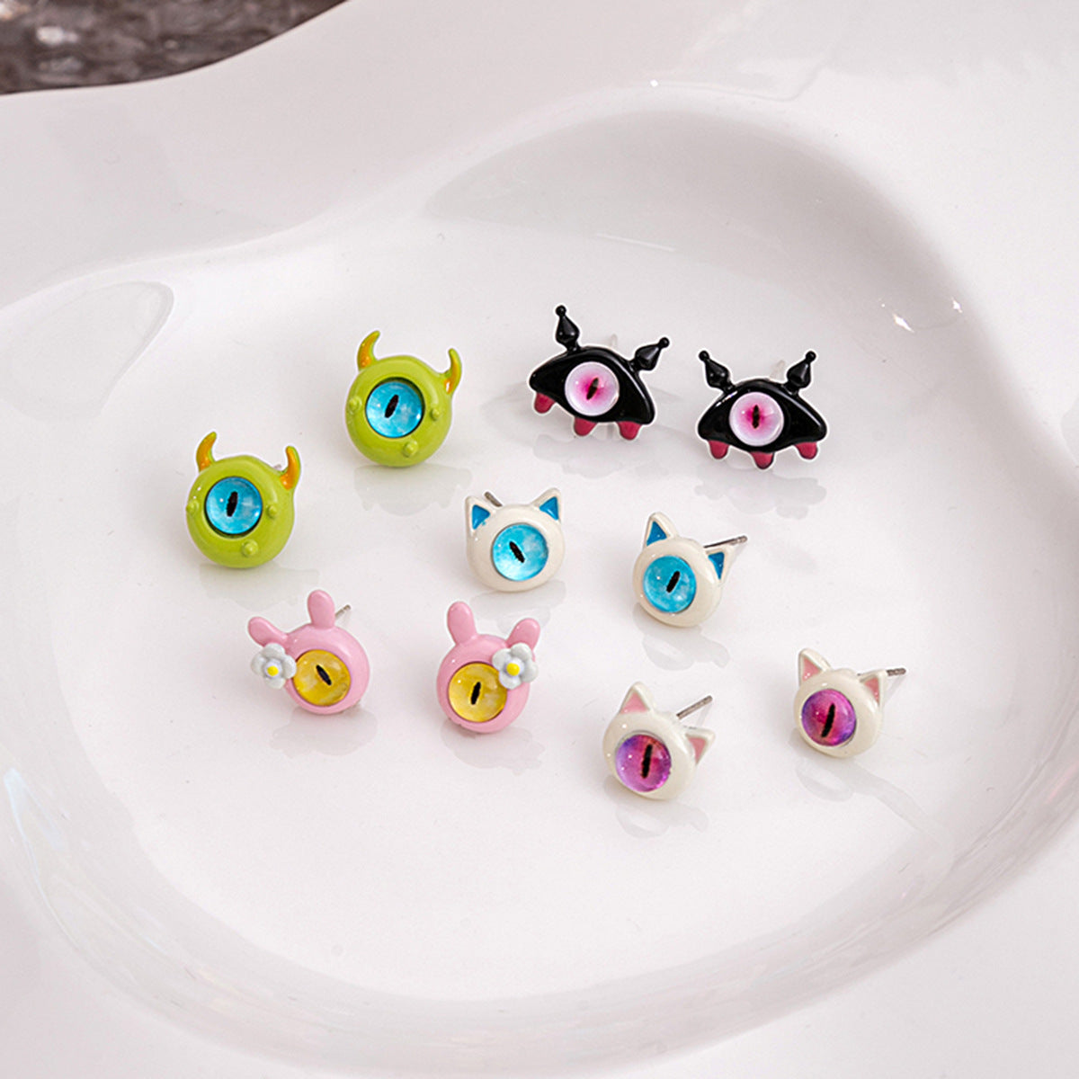 Alloy cartoon oil dripping cat's eye stone earrings MIC-MDD161